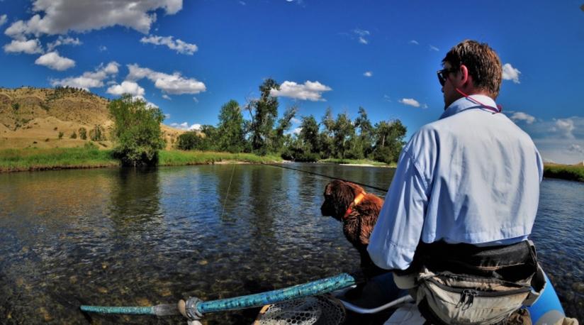 Beartooth raft fishing with a dog